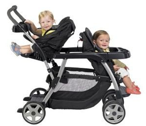 two cute babies enjoy their ride on double Graco stoller