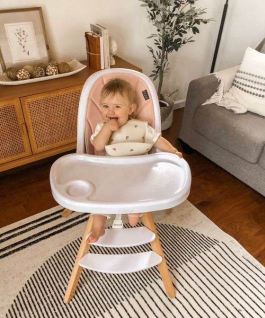 when can baby sit in a high chair